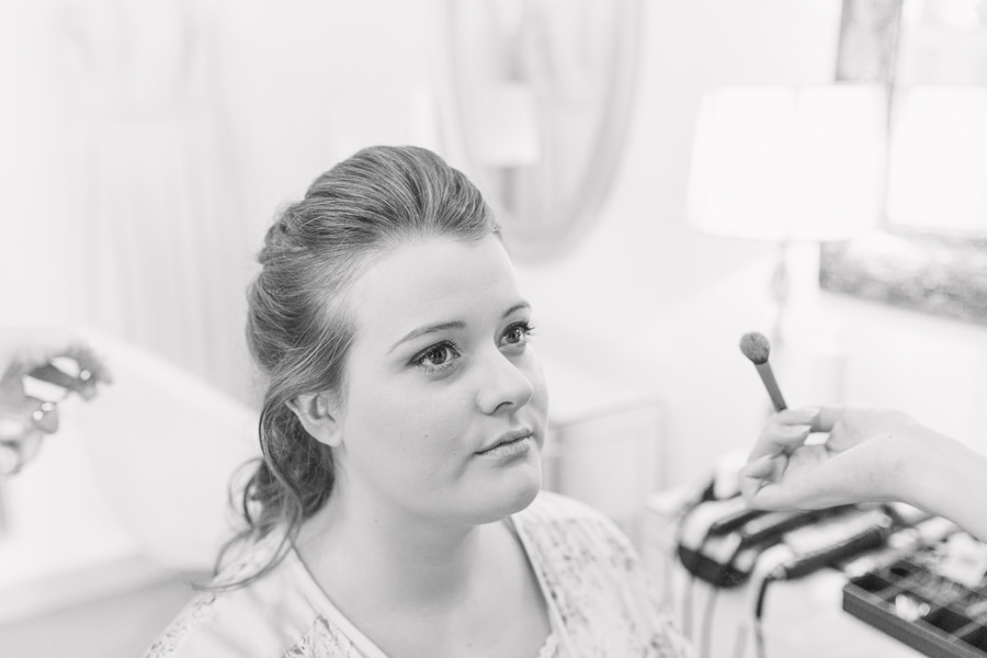 herefordshire wedding photography lemore manor tabitha muccurrach paine hair - bride having her makeup finished on the morning of her wedding - image by hayley morris photography 