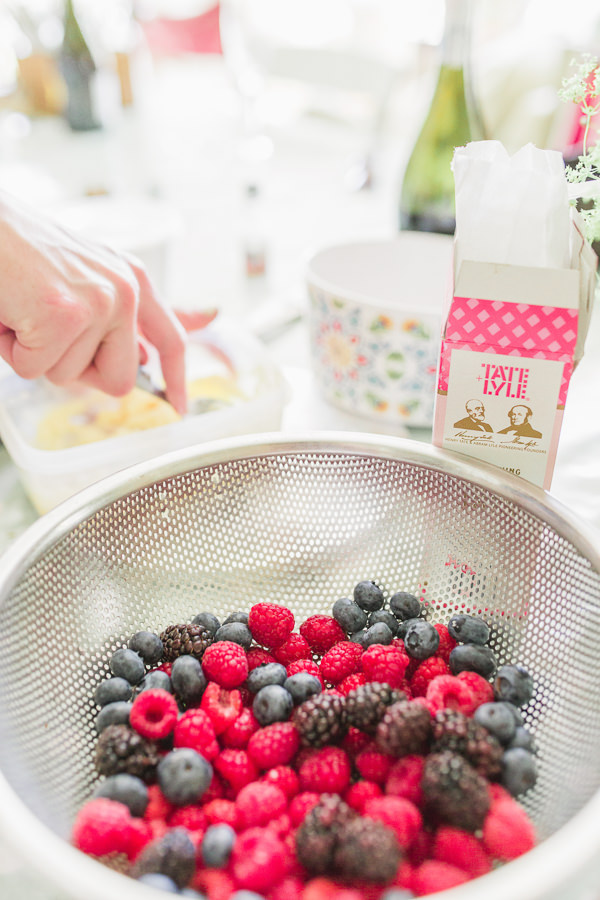 fine art wedding photography cotswolds gloucestershire bur ford oxfordshire fairford image shows fruit for wedding cake decoration in a sieve and cake ingredients in the background - image by hayley morris photography
