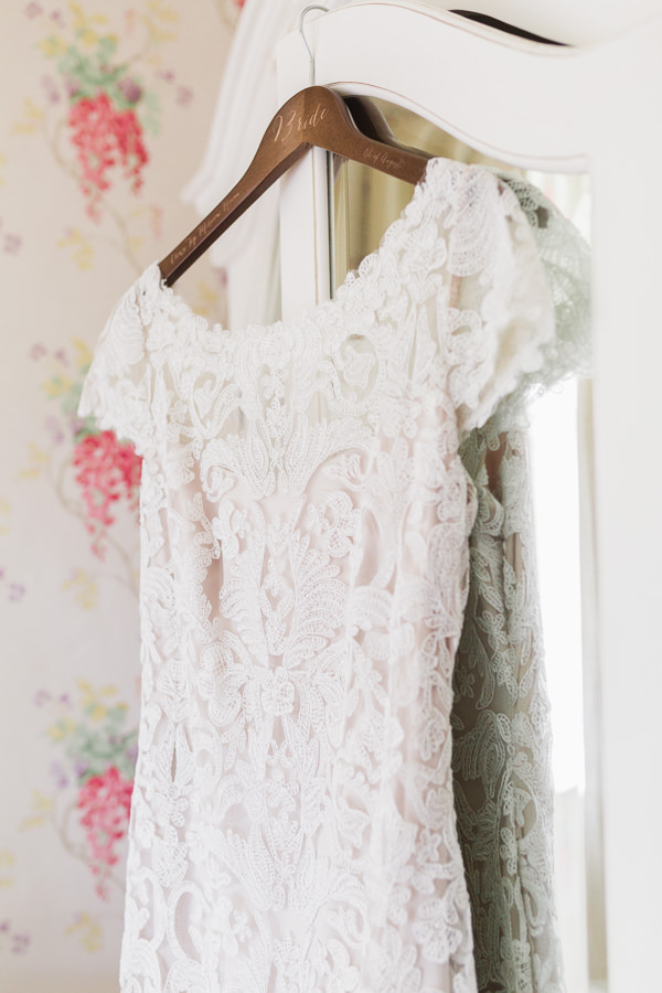 fine art wedding photography worcestershire west midlands bride's lace wedding dress hanging at kateshill house by hayley morris photography