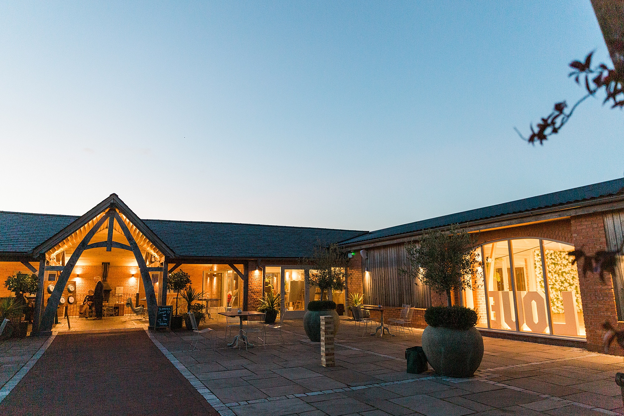 photo showing the exterior of cider mill barns near stratford in the early evening at dusk all lit up beautifully