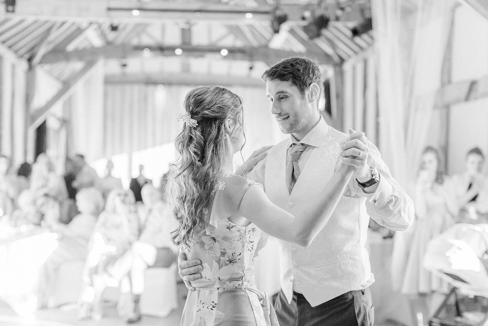 Photo of a bride and groom dancing their choreographed first dance at their wedding in a barn at hellens manor in herefordshire