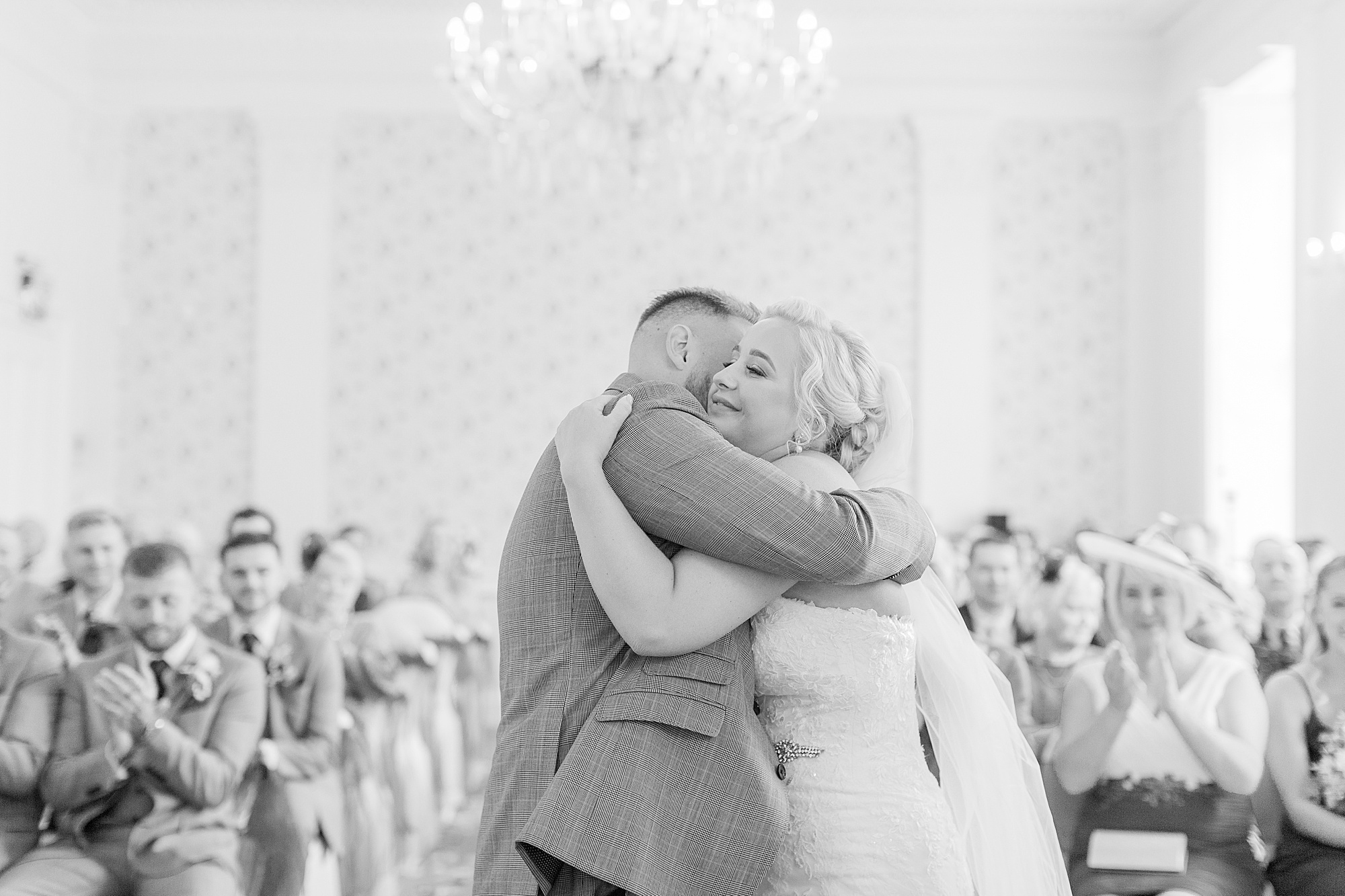 photo of a bride and groom hugging each other during their ceremony at himley hall midlands