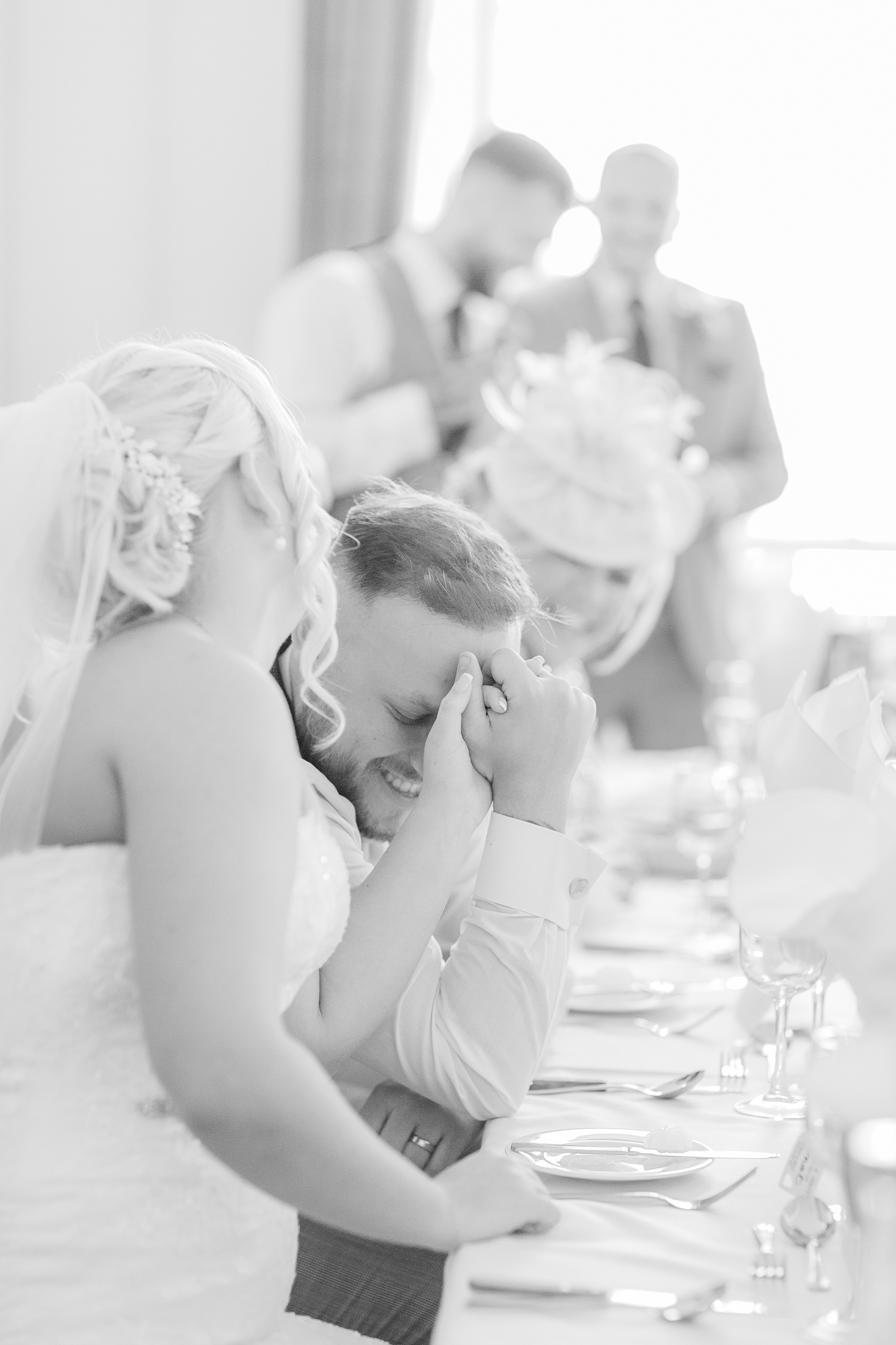 photo of the groom's reaction during the speeches at his wedding