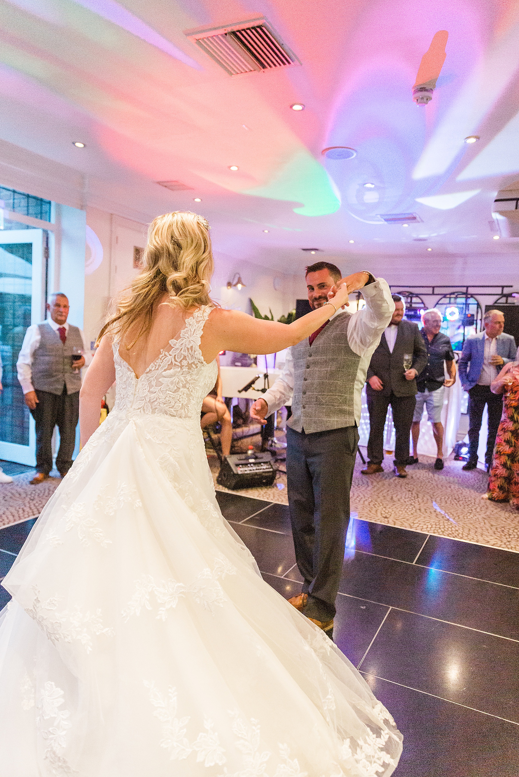 Photo of a bride and groom dancing their first dance together at their wedding at hograths stone manor