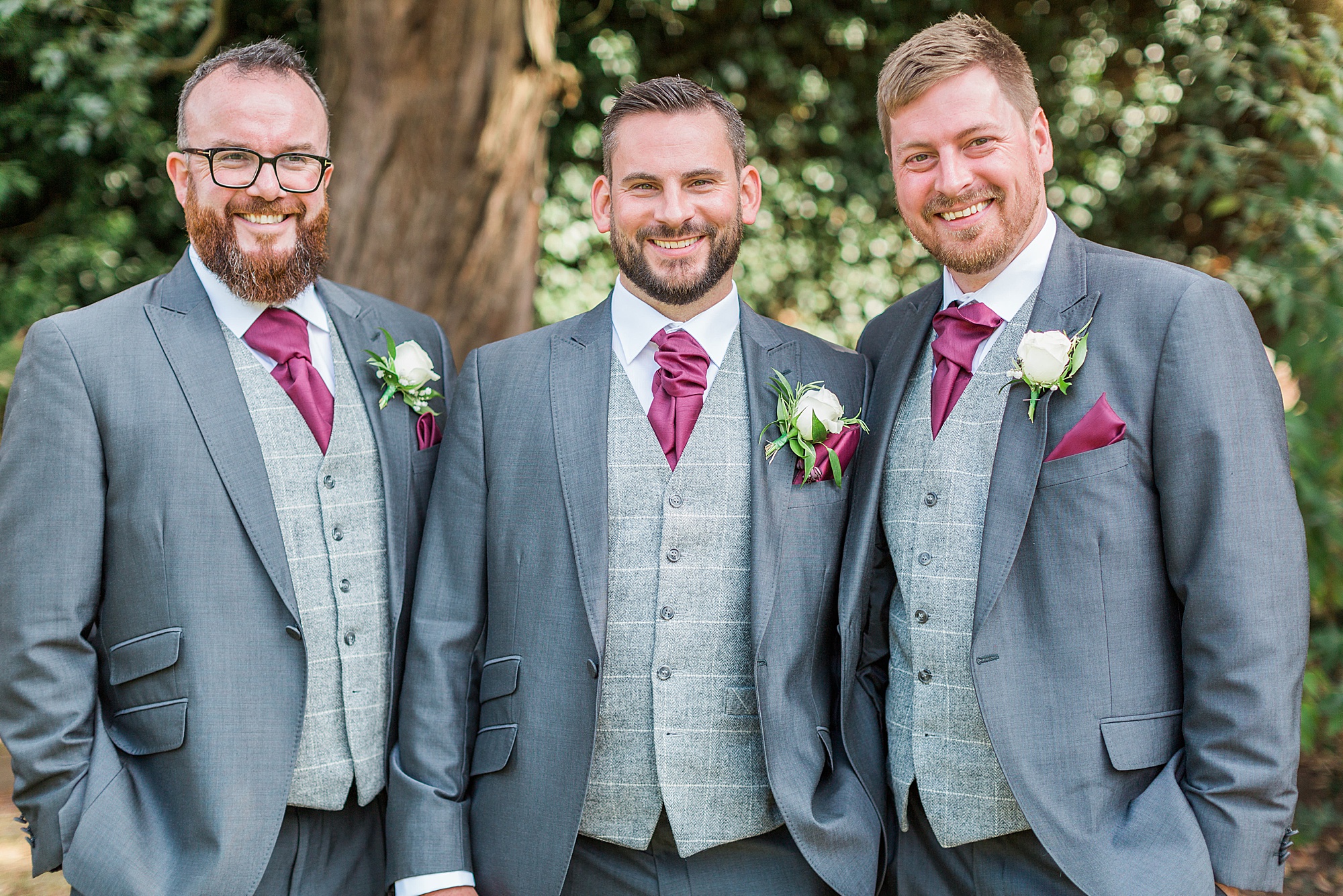 photo of a groom and groomsmen having a more formal group photo taken in the grounds of hogarths stone manor 
