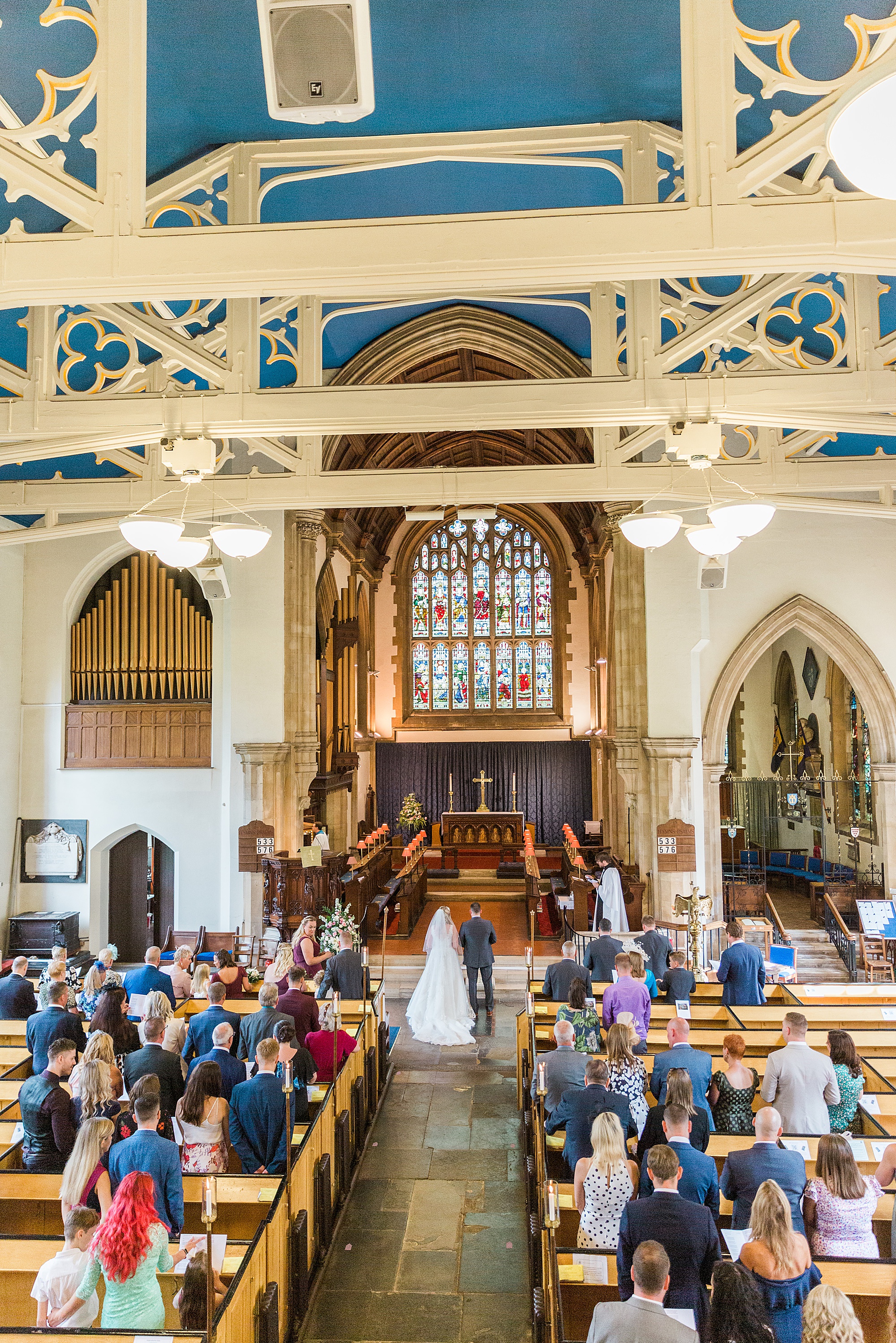 photo taken from the balcony at the back of a church in halesowen of the wedding ceremony 