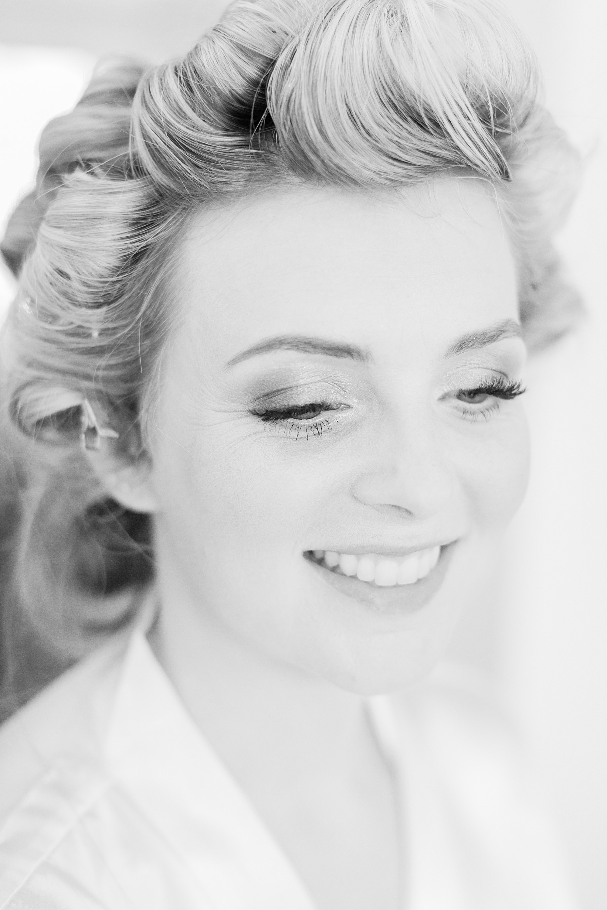 photograph shows a portrait of a bride having had her makeup applied ready for her wedding