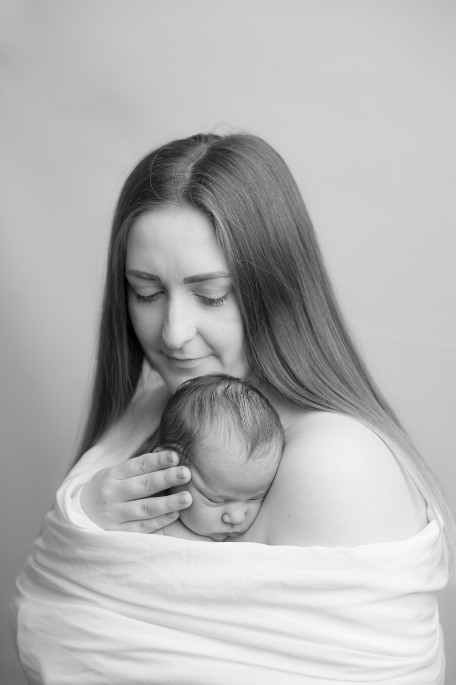 Hayley Morris photography newborn photographer malvern worcester mum wrapped in silk with baby skin to skin 