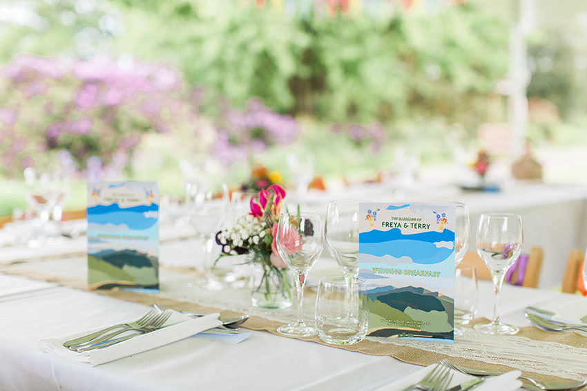 menu and place settings at an outdoor wedding reception on a lawn at homme house