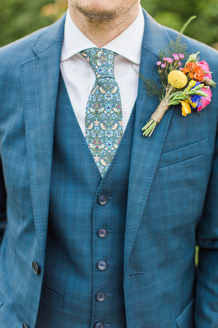 detail of the groom in his suit with buttonhole 